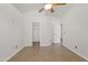 Bright bedroom featuring tile flooring, ceiling fan, and doorway to the rest of the home at 3114 E Kristal Way, Phoenix, AZ 85050
