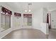 Bright dining area with tiled floors and natural lighting from windows at 3114 E Kristal Way, Phoenix, AZ 85050