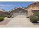 Suburban home featuring desert landscaping, a driveway and a two-car garage at 3114 E Kristal Way, Phoenix, AZ 85050