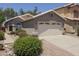 Inviting single-story home with a two-car garage and low maintenance desert landscaping in front at 3114 E Kristal Way, Phoenix, AZ 85050
