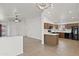 Well-equipped kitchen with sleek countertops, wooden cabinets, and modern black appliances at 3114 E Kristal Way, Phoenix, AZ 85050