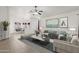 Stylishly furnished living room with a ceiling fan, tile flooring, and neutral decor at 3114 E Kristal Way, Phoenix, AZ 85050