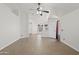 Large, airy living room with tile floors and a ceiling fan, perfect for gatherings at 3114 E Kristal Way, Phoenix, AZ 85050