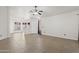 Bright, spacious living room featuring tile flooring and a ceiling fan at 3114 E Kristal Way, Phoenix, AZ 85050