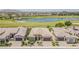 Aerial view of home in community highlighting its golf course and lake views at 36172 N Secret Garden Path, Queen Creek, AZ 85140