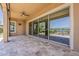 Back porch with tiled flooring overlooking the pond and golf course at 36172 N Secret Garden Path, Queen Creek, AZ 85140