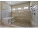 Luxurious bathroom featuring tiled shower with glass enclosure at 36172 N Secret Garden Path, Queen Creek, AZ 85140