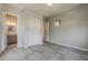 A modern bedroom has a ceiling fan, closet and an ensuite bathroom at 36172 N Secret Garden Path, Queen Creek, AZ 85140