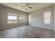 Large bedroom with tile flooring and large window at 36172 N Secret Garden Path, Queen Creek, AZ 85140