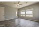 Large bedroom with ample natural light and tile flooring at 36172 N Secret Garden Path, Queen Creek, AZ 85140