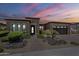 Charming home with well-manicured landscaping, desert accents, and a welcoming entrance at 36172 N Secret Garden Path, Queen Creek, AZ 85140