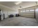 Bright garage with an automatic door and plenty of space at 36172 N Secret Garden Path, Queen Creek, AZ 85140