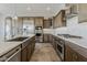 Bright kitchen with stainless steel appliances and tile flooring at 36172 N Secret Garden Path, Queen Creek, AZ 85140