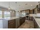Spacious kitchen with large island, stainless appliances, and backyard views at 36172 N Secret Garden Path, Queen Creek, AZ 85140