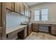 Large laundry room with custom cabinetry and sink at 36172 N Secret Garden Path, Queen Creek, AZ 85140