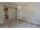Bright living room with tile floors and modern lighting at 36172 N Secret Garden Path, Queen Creek, AZ 85140