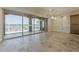 Open-concept living room with large sliding glass doors to outdoor patio and views of the water at 36172 N Secret Garden Path, Queen Creek, AZ 85140