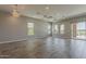 Open living room with tile floors and large windows at 36172 N Secret Garden Path, Queen Creek, AZ 85140