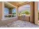 Outdoor kitchen area featuring a tile floor and built in grill at 36172 N Secret Garden Path, Queen Creek, AZ 85140