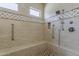 Detail of tiled walk-in shower with built-in bench and showerhead at 36172 N Secret Garden Path, Queen Creek, AZ 85140