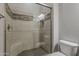 A gorgeous walk-in shower with glass doors is the perfect place to start your day at 36172 N Secret Garden Path, Queen Creek, AZ 85140