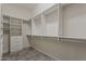 A huge walk-in closet features custom shelving and space for all of your wardrobe at 36172 N Secret Garden Path, Queen Creek, AZ 85140