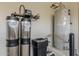 Close-up of the home's water filtration and water heater system at 36172 N Secret Garden Path, Queen Creek, AZ 85140