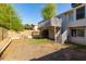Backyard view featuring a raised deck, ladder, and ample space at 3755 E Broadway Rd # 36, Mesa, AZ 85206