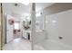 Bright bathroom featuring white cabinets, double sink vanity, and a separate tub area at 3755 E Broadway Rd # 36, Mesa, AZ 85206