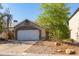 Charming single-story home featuring a two-car garage and a well-maintained, low-maintenance front yard at 3755 E Broadway Rd # 36, Mesa, AZ 85206