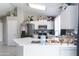 Stylish kitchen features white cabinets, stainless steel appliances, and a bright, functional layout at 3755 E Broadway Rd # 36, Mesa, AZ 85206