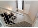 View from the top of the stairs showcasing a cozy living room with comfortable seating and neutral decor at 3755 E Broadway Rd # 36, Mesa, AZ 85206