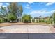 Expansive backyard featuring a well-maintained lawn, mature trees, and privacy fence at 4278 E Del Rio Dr, San Tan Valley, AZ 85140