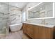 Stunning bathroom featuring a soaking tub, double vanity, and elegant tile work at 4278 E Del Rio Dr, San Tan Valley, AZ 85140