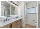 Modern bathroom featuring double sinks, a large mirror, and a walk-in shower at 4278 E Del Rio Dr, San Tan Valley, AZ 85140