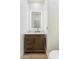 Charming bathroom with wood vanity, marble countertop, and modern lighted mirror at 4278 E Del Rio Dr, San Tan Valley, AZ 85140