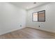 Bedroom with neutral walls and hardwood floors and an exterior view at 4278 E Del Rio Dr, San Tan Valley, AZ 85140