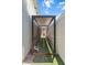 Outdoor dog run between houses with metal fencing and artificial turf at 4278 E Del Rio Dr, San Tan Valley, AZ 85140