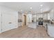 Modern kitchen features white cabinetry, stainless appliances, and a center island with granite countertops at 4278 E Del Rio Dr, San Tan Valley, AZ 85140