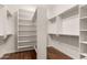 Walk-in closet featuring wood floors and built-in shelving for optimal organization at 4332 S Oregon Ct, Chandler, AZ 85248