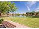 Inviting community park with a serene pond view and comfortable bench seating at 4332 S Oregon Ct, Chandler, AZ 85248
