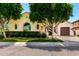 Beautiful home exterior featuring lush landscaping, a manicured lawn, and an inviting facade at 4332 S Oregon Ct, Chandler, AZ 85248