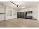 Spacious garage with epoxy flooring and custom cabinets for optimal storage at 4332 S Oregon Ct, Chandler, AZ 85248