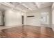 Spacious living room featuring hardwood floors, a modern light fixture, and an open floor plan at 4332 S Oregon Ct, Chandler, AZ 85248