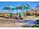 Community playground with covered play areas, providing shade for children to play at 4332 S Oregon Ct, Chandler, AZ 85248