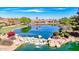 Scenic pond view featuring a waterfall and lush landscaping in a beautiful community at 4332 S Oregon Ct, Chandler, AZ 85248