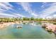 Beautiful community pond with lush landscaping and rock features, creating a tranquil environment at 4332 S Oregon Ct, Chandler, AZ 85248