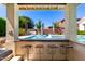 This pool features a swim-up bar with seating, perfect for enjoying refreshments in the sun at 4332 S Oregon Ct, Chandler, AZ 85248
