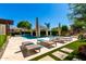 Resort-style pool with cabana, lounge chairs, and well-manicured landscaping at 4332 S Oregon Ct, Chandler, AZ 85248