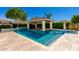 Beautiful pool with cabana, waterfall, and lush landscaping, perfect for outdoor entertaining at 4332 S Oregon Ct, Chandler, AZ 85248